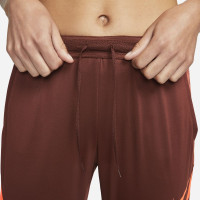 Pantalon d'entraînement Nike Dri-Fit Strike 21 pour femme Marron Rouge Orange