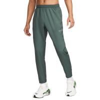 Pantalon d'entraînement tissé Nike Challenger vert noir argent