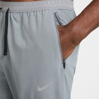 Nike Stride Trainingsbroek Woven Grijs Zilver
