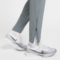 Nike Stride Trainingsbroek Woven Grijs Zilver