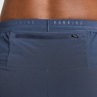 Pantalon d'entraînement tissé Nike Stride bleu foncé argenté