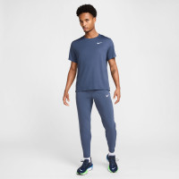 Pantalon d'entraînement tissé Nike Stride bleu foncé argenté