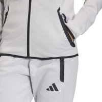 Combinaison de jogging zippée adidas Tiro Travel pour femmes, gris