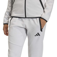 Combinaison de jogging zippée adidas Tiro Travel pour femmes, gris