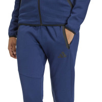 Combinaison de jogging zippée adidas Tiro Travel pour femmes, bleu foncé