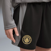 PUMA Manchester City Trainingsbroekje 2026-2027 Kids Zwart Donkergrijs Goud