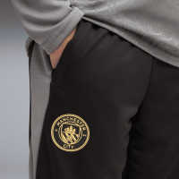 Pantalon d'entraînement PUMA Manchester City 2026-2027 pour enfants, noir, gris foncé, or