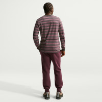 Pantalon de survêtement en polaire Nike Sportswear Club bordeaux doré